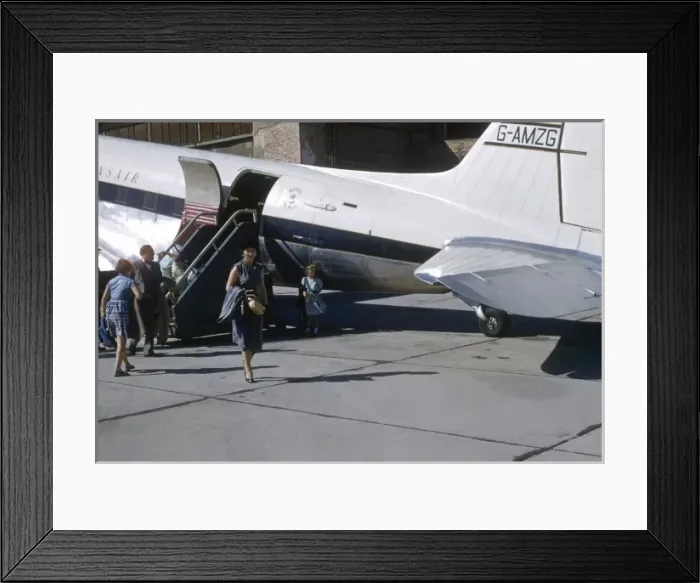 Framed Print : People disembark from a Transair aeroplane Framed Print : People disembark from a Transair aeroplane