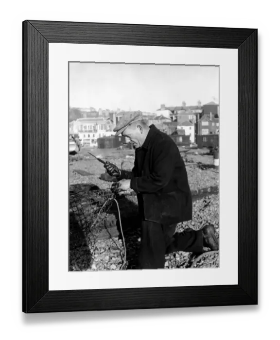 Framed Print : Fisherman mending nets at Hastings, Sussex Framed Print : Fisherman mending nets at Hastings, Sussex
