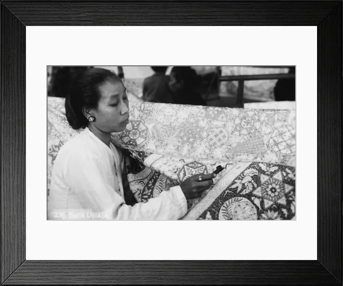 Framed Print : Decorating fabric with Batik Framed Print : Decorating fabric with Batik