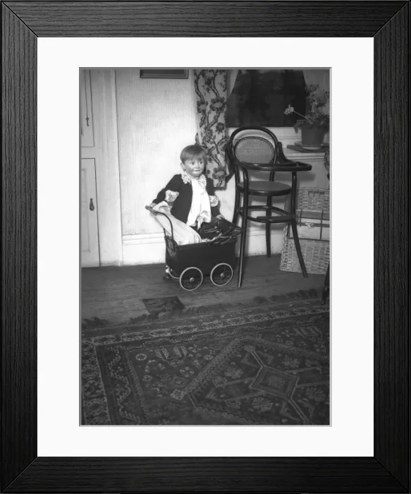 Framed Print : Little boy with a toy pram Framed Print : Little boy with a toy pram