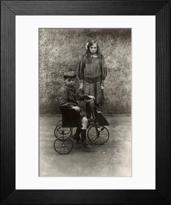Framed Print : Posing with a toy pedal car Framed Print : Posing with a toy pedal car