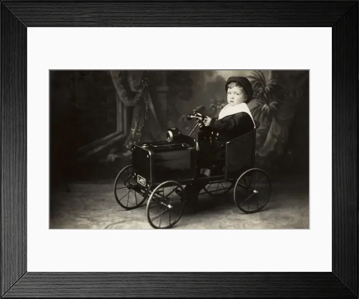Framed Print : Young boy in toy car Framed Print : Young boy in toy car