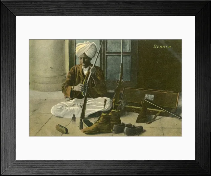 Framed Print : Indian Bearer - cleaning his Masters shoes and rifle Framed Print : Indian Bearer - cleaning his Masters shoes and rifle