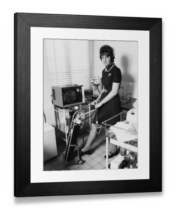 Framed Print : Nurse with equipment at the Medical Centre, Hendon Framed Print : Nurse with equipment at the Medical Centre, Hendon