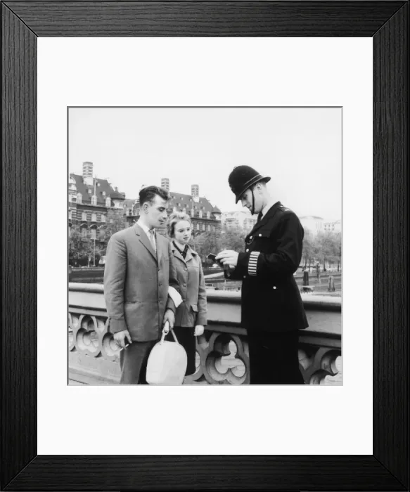 Framed Print : Met Police officer giving directions Framed Print : Met Police officer giving directions