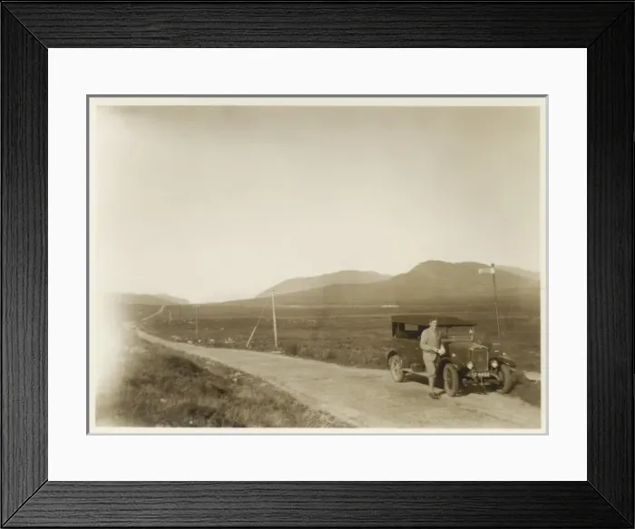 Framed Print : Man and car in the Scottish Highlands Framed Print : Man and car in the Scottish Highlands