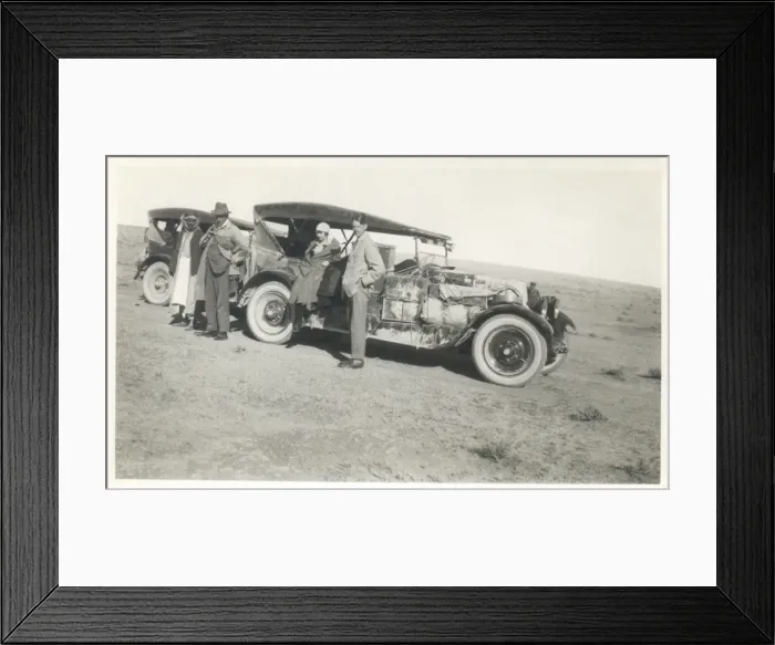 Framed Print : Four people with two loaded cars, Middle East Framed Print : Four people with two loaded cars, Middle East