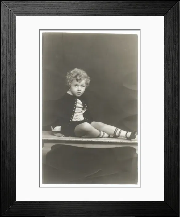 Framed Print : Curly haired boy in photographers studio Framed Print : Curly haired boy in photographers studio