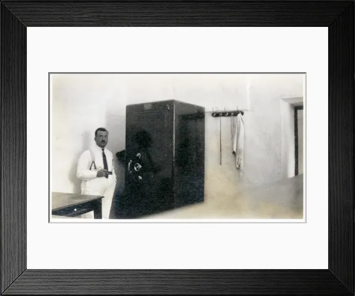 Framed Print : Iraqi bank official with a large safe, Iraq Framed Print : Iraqi bank official with a large safe, Iraq
