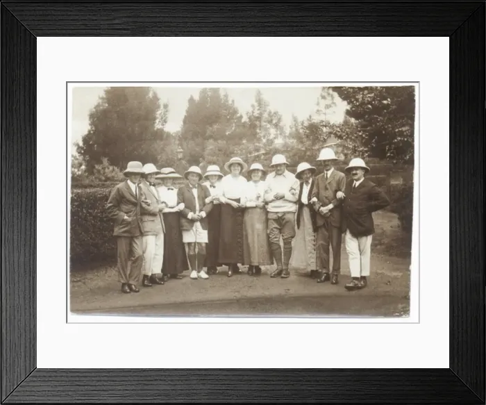 Framed Print : Eleven people in a garden wearing pith helmets Framed Print : Eleven people in a garden wearing pith helmets