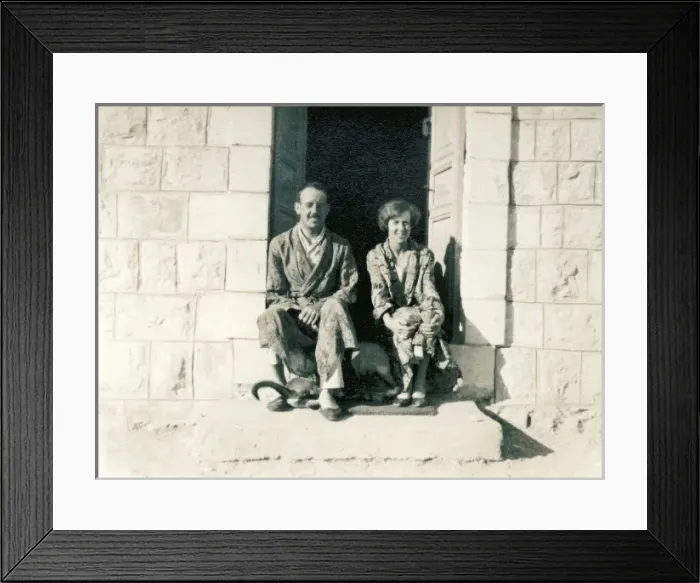Framed Print : Couple in pyjamas sitting on a stone step in the sun Framed Print : Couple in pyjamas sitting on a stone step in the sun