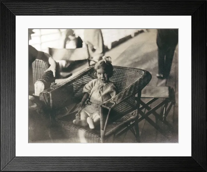 Framed Print : Little girl in a wickerwork chair, Middle East Framed Print : Little girl in a wickerwork chair, Middle East