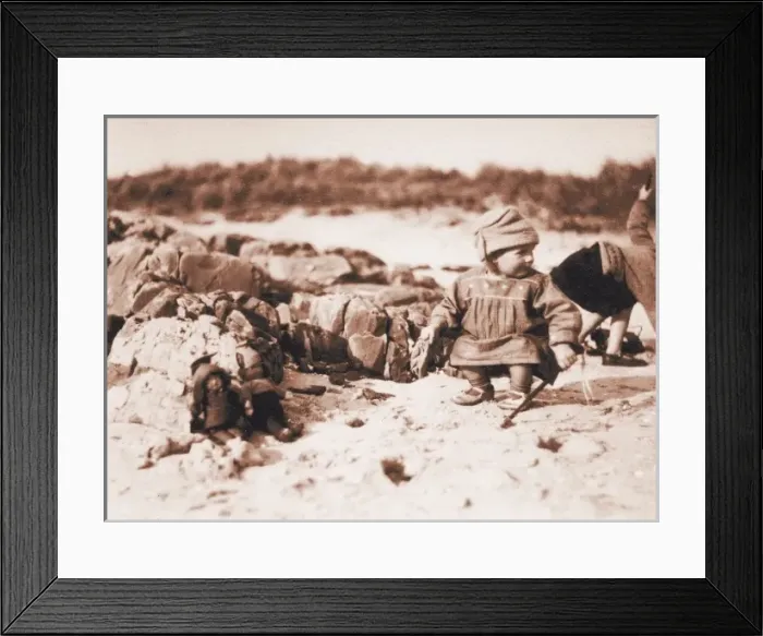 Framed Print : Two children with dolls on a beach, Scotland Framed Print : Two children with dolls on a beach, Scotland