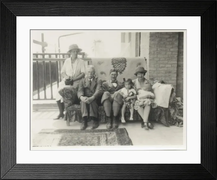 Framed Print : Family group on a sofa on a verandah Framed Print : Family group on a sofa on a verandah