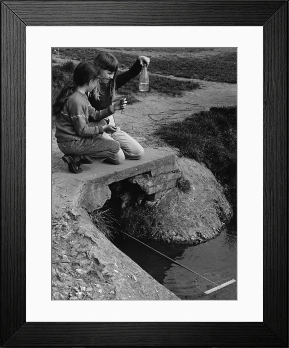 Framed Print : Two girls fishing in a stream Framed Print : Two girls fishing in a stream