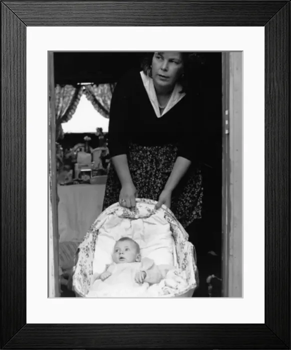 Framed Print : Woman with a baby in a cottage doorway Framed Print : Woman with a baby in a cottage doorway