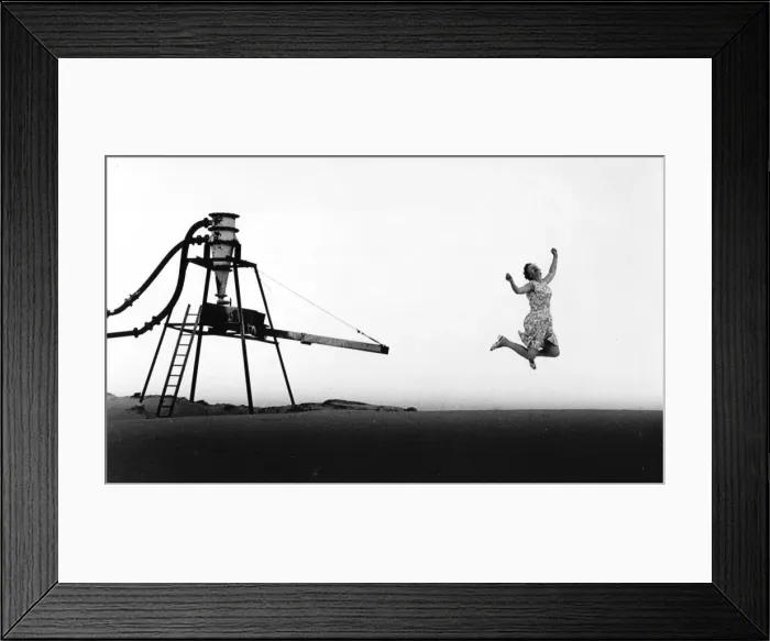 Framed Print : Jumping woman at a gravel pit Framed Print : Jumping woman at a gravel pit