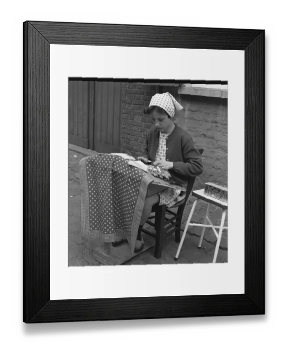 Framed Print : Young girl making lace on the pavement