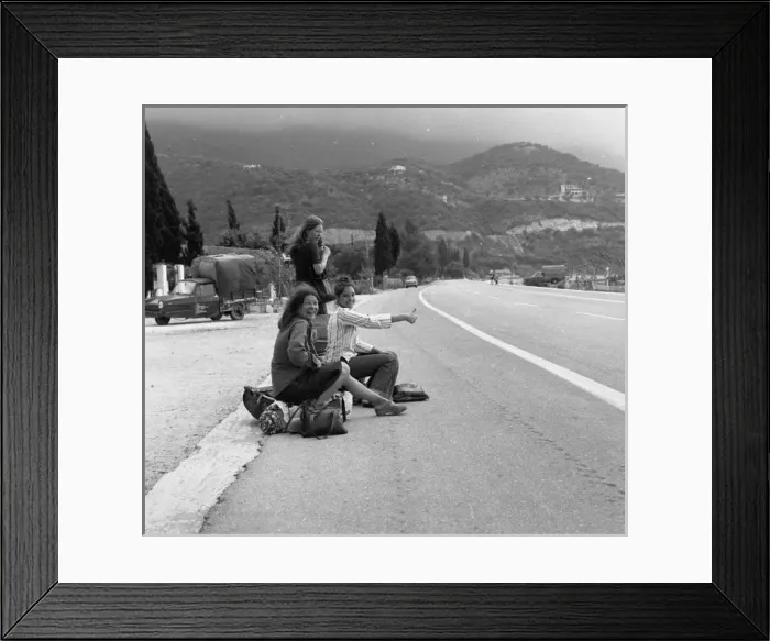 Framed Print : Three young women hitch-hiking