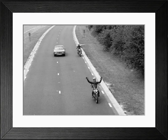 Framed Print : Two motorcyclists overtaking a car Framed Print : Two motorcyclists overtaking a car