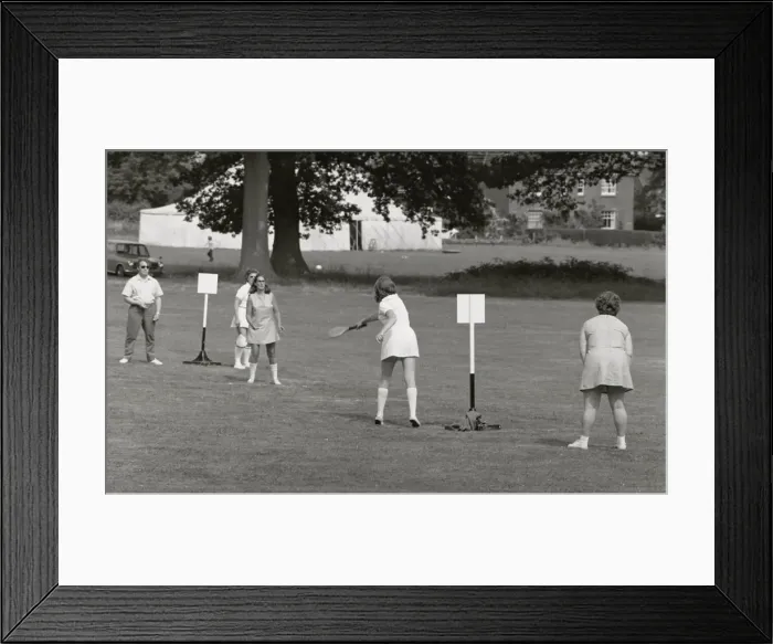Framed Print : Five people playing a ball game in a field Framed Print : Five people playing a ball game in a field