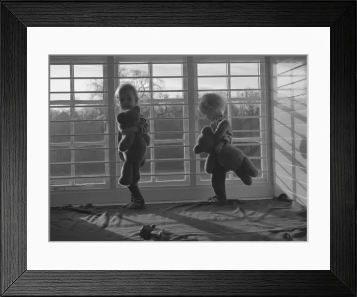 Framed Print : Two small children with teddy bears in a nursery Framed Print : Two small children with teddy bears in a nursery