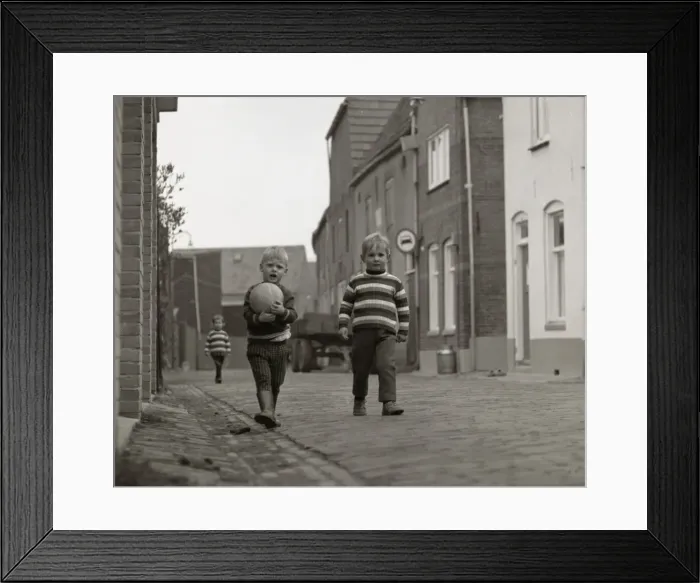 Framed Print : Two boys with a football in the street Framed Print : Two boys with a football in the street