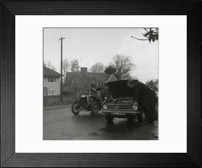 Framed Print : Broken down modern car overtaken by veteran model Framed Print : Broken down modern car overtaken by veteran model