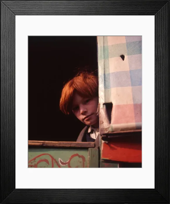Framed Print : Red-haired gipsy boy looking out of his caravan Framed Print : Red-haired gipsy boy looking out of his caravan