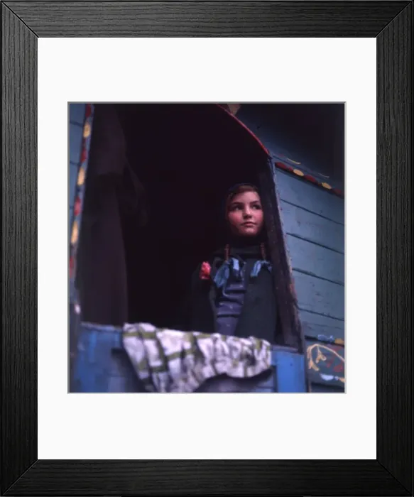 Framed Print : Gipsy girl looking out of the back of her caravan Framed Print : Gipsy girl looking out of the back of her caravan