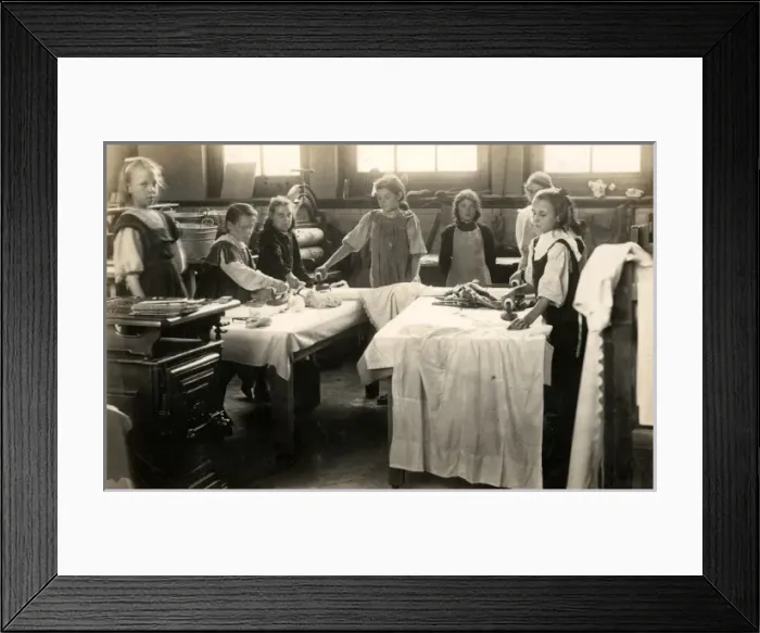 Framed Print : Young girls ironing in laundry room, Surrey Framed Print : Young girls ironing in laundry room, Surrey