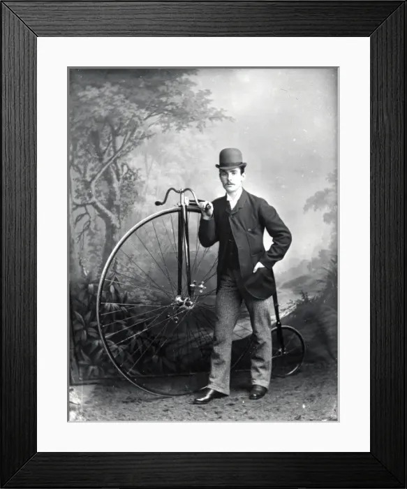 Framed Print : Young man and pennyfarthing, Haverfordwest, South Wales Framed Print : Young man and pennyfarthing, Haverfordwest, South Wales