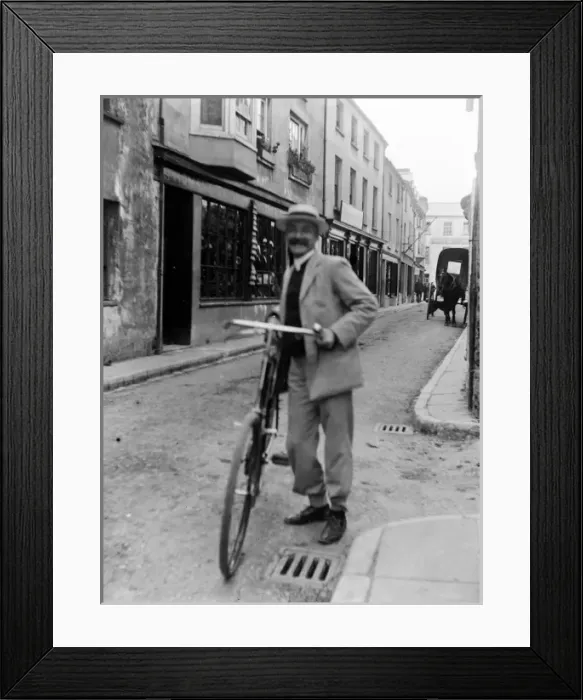 Framed Print : Cyclist in Bridge Street, Haverfordwest, South Wales Framed Print : Cyclist in Bridge Street, Haverfordwest, South Wales