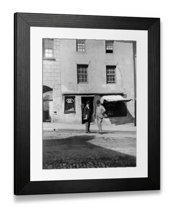 Framed Print : Men outside shop, High Street, Haverfordwest, South Wales Framed Print : Men outside shop, High Street, Haverfordwest, South Wales