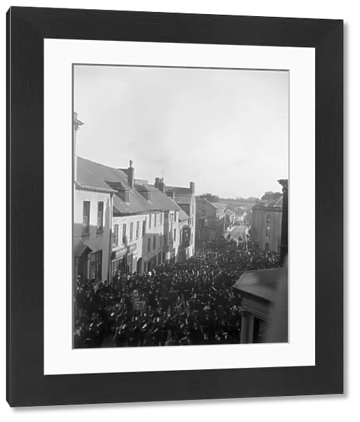 Soldiers march up High Street, Haverfordwest, South Wales