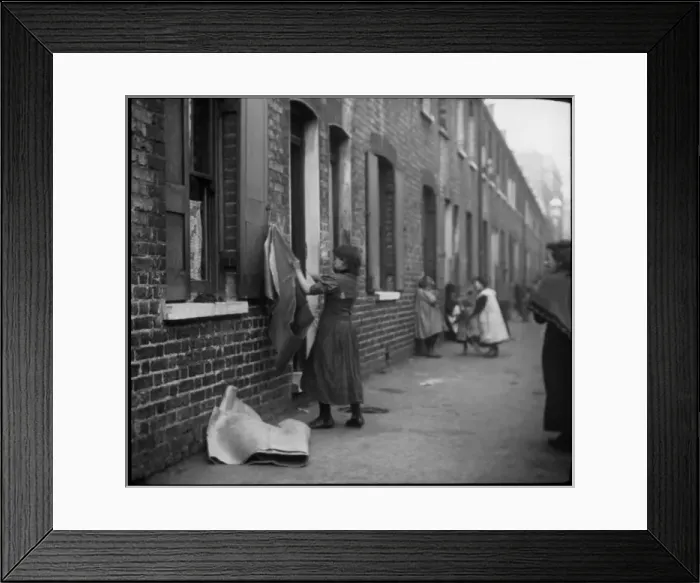 Framed Print : People on a street of terraced housing, London Framed Print : People on a street of terraced housing, London
