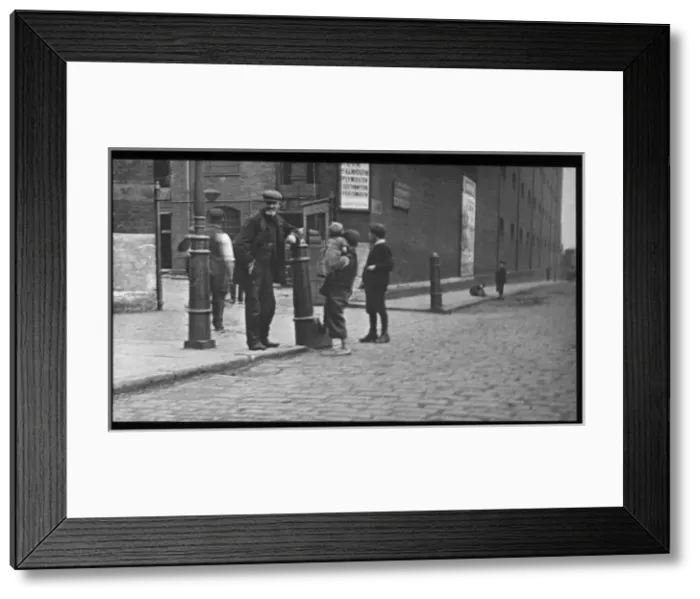 Framed Print : Adults and children on a London street Framed Print : Adults and children on a London street