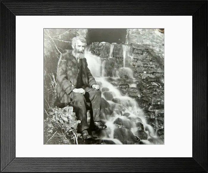 Framed Print : Elderly man sitting by mill outflow Framed Print : Elderly man sitting by mill outflow