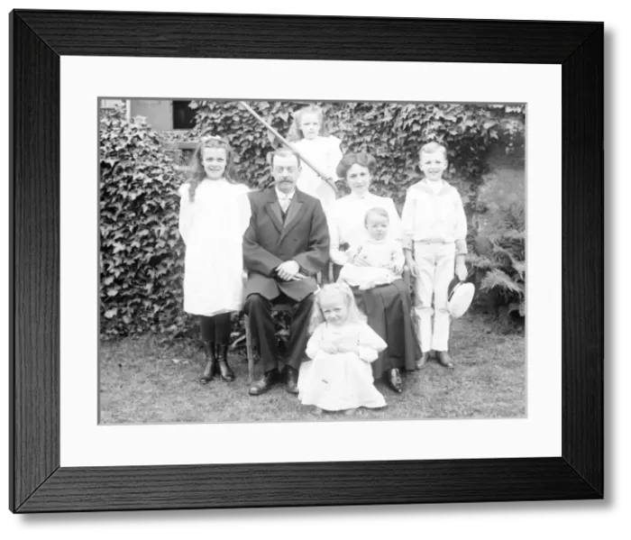 Framed Print : Middle class family group in a garden, Mid Wales Framed Print : Middle class family group in a garden, Mid Wales