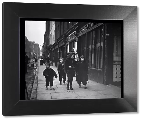Four boys in a street in the East End of London
