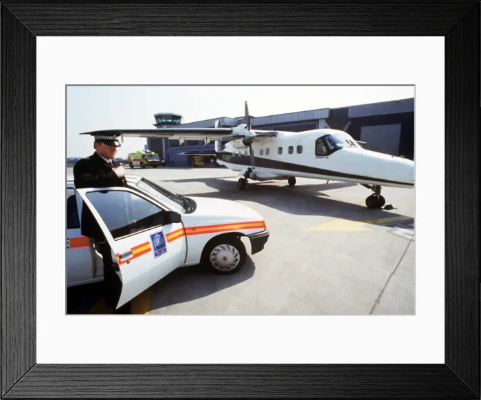 Framed Print : Policeman, car and light aircraft Framed Print : Policeman, car and light aircraft