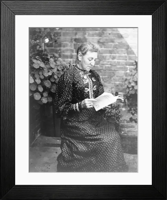 Framed Print : Middle aged woman reading in a garden, Mid Wales Framed Print : Middle aged woman reading in a garden, Mid Wales