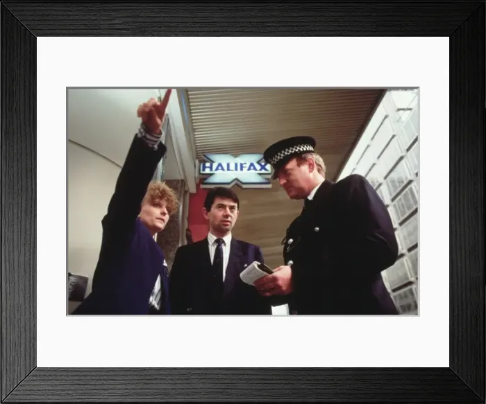 Framed Print : Policeman at a building society premises Framed Print : Policeman at a building society premises