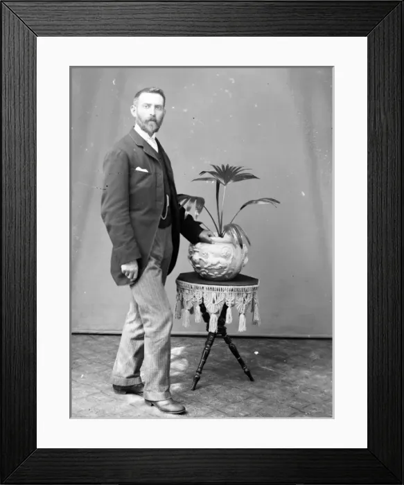 Framed Print : Middle aged man with potted palm, Mid Wales Framed Print : Middle aged man with potted palm, Mid Wales