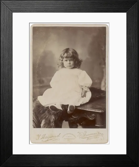 Framed Print : Edwardian girl sitting on a table Framed Print : Edwardian girl sitting on a table