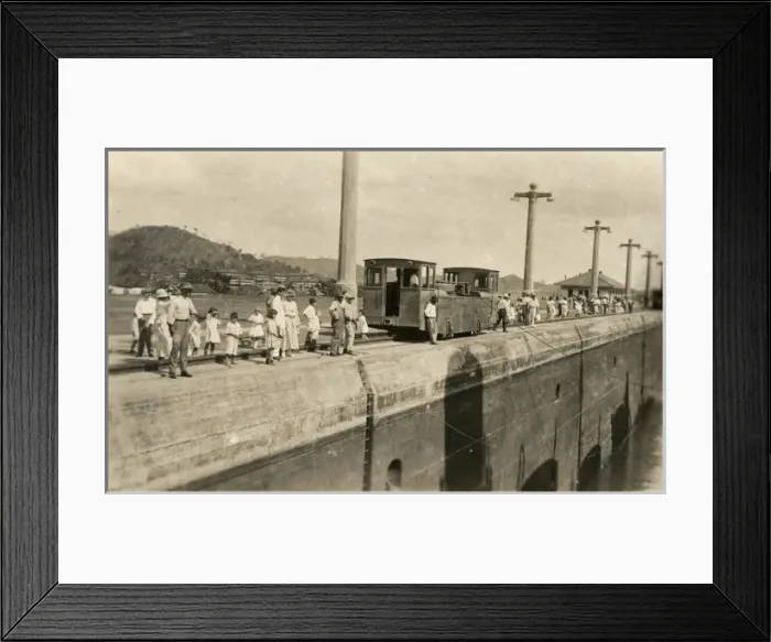 Framed Print : Locals gather along the canal to see the passing of a ship Framed Print : Locals gather along the canal to see the passing of a ship