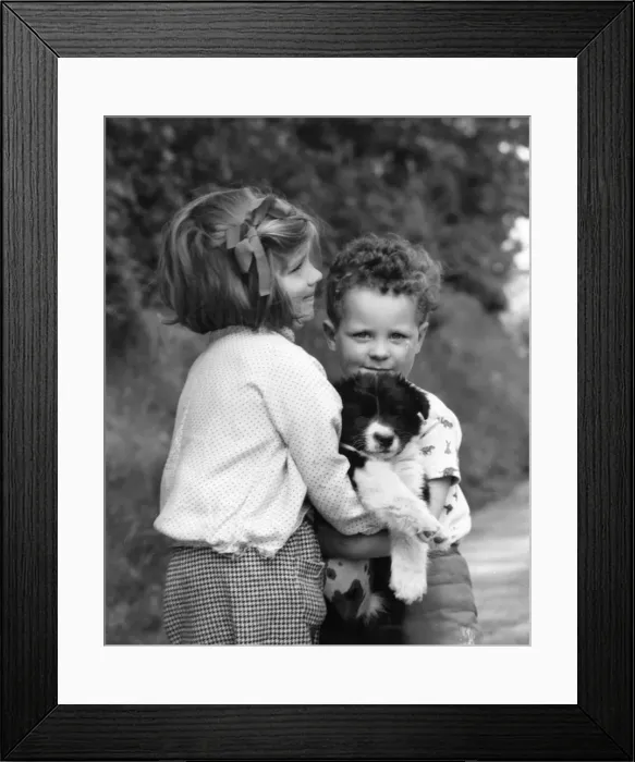 Framed Print : Brother and sister with new puppy Framed Print : Brother and sister with new puppy