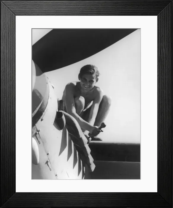 Framed Print : Man fixing an aeroplane
