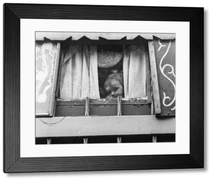 Framed Print : Gipsy toddler peeping out of his caravan Framed Print : Gipsy toddler peeping out of his caravan