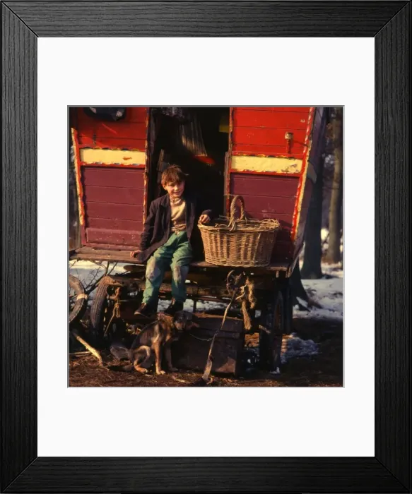 Framed Print : Gipsy boy sitting on the back step of his caravan Framed Print : Gipsy boy sitting on the back step of his caravan